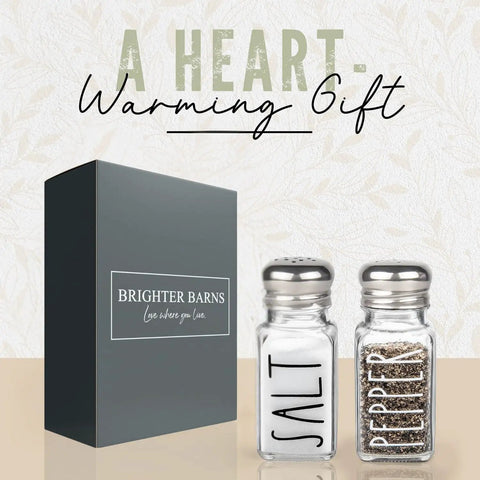 Clear Glass Salt And Pepper Shaker Set With Stainless Steel Lids for Modern Farmhouse Kitchen Decor next to gift box