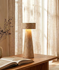 Travertine Stone Table Lamp With Warm White LED, Japanese Wabi Sabi Mushroom Nightstand Light on wooden desk near open book