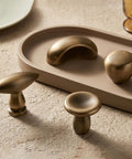 French Antique Brass Egg Cabinet Knobs 1.075 Inch Teardrop Zinc Alloy Drawer Knobs Single Hole Pulls on stone surface
