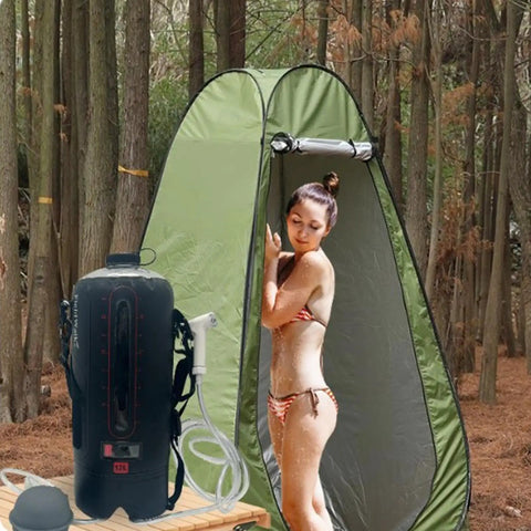 Foldable 12L Solar Heated Camping Shower Kit with removable hose and showerhead in use outdoors by a tent