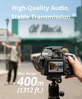 Photographer using DSLR with Small But Mighty Wireless Lavalier Microphone System for iPhone, Android, and Cameras outdoors.
