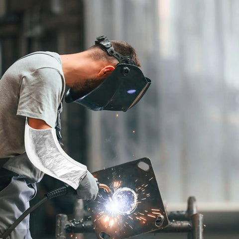 Heavy Duty Heat Resistant Aluminum Foil Arm Sleeves, Waterproof Cut Resistant Forearm Guards Shop Tough Armor For Welders Mechanics And Garage Grinders, 2 Pack. Worker wearing sleeve while welding.