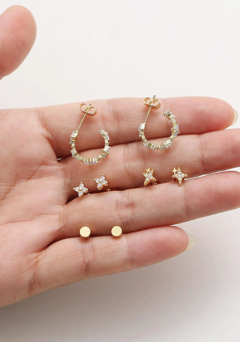 Gold Plated Earring Set For Women 9 Pairs Including Huggie Hoops Planet Ball Flower Dangle Studs Flat Back Cartilage Tragus Earrings For Multiple Piercings Stackable Jewelry Perfect For Everyday Vibe. Gold plated 9-pair earring set on hand.