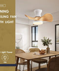 Compact 20 Inch Ceiling Fan With Light And Remote Whisper Quiet DC Motor Farmhouse Vibe Flush Mount Three Reversible Blades Ideal For Kitchen Dining Room Bedroom Office installed above a dining table in a modern room.