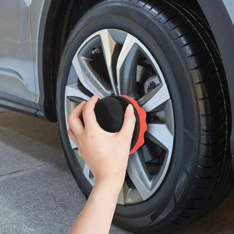 Applying tire shine with Two Pack Large Tire Shine Applicator Pads With Hex Grip For Even Coats Of Tire Shine on car wheel