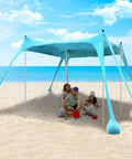Family enjoying shade under Beach Canopy Tent 11 By 11 Ft With 6 Sandbags, 4 Stability Poles, on a sunny beach day.