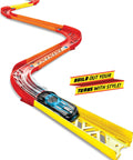 Track Builder Unlimited Playset Premium Curve Pack With 16 Component Parts And 1 64 Scale Vehicle on a winding track.