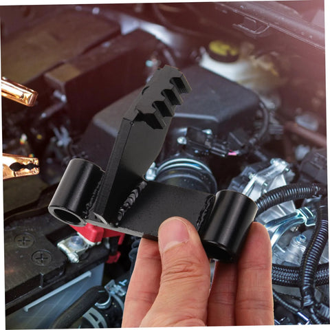Black metal flywheel holding tool for automotive engines; toothed end and locking bracket.
