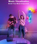 Two people enjoying music with Lit RGB Hexagon LED Panel Lights For Wall illuminating the room, enhancing ambiance.
