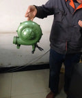 Person holding Electric Blacksmith Forge Blower 110V 250W For Coal Fires, High CFM Draft Fan With 380Pa Pressure