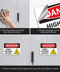 Applying Heavy Duty Danger High Voltage Warning Signs Five Pack Tough As Nails Weatherproof decals to a metal surface.