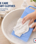 Heavy Duty Japanese Plastic Washboard For Laundry Scrubbing Portable Hand Wash Board being used to wash delicate baby clothes.