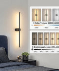 ONEWISH Battery Operated Wall Sconces Set of 2, 27.75" elegant wall light in a bedroom with adjustable brightness features.
