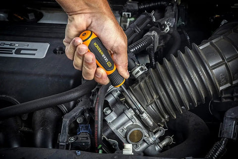 20 Piece Phillips Slotted And Torx Screwdriver Set With Dual Material Handles And Speed Zone Grip For Faster Turns in use on engine