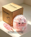 Totally Sweet Handmade Squishy Hamster Toy For Chill Out Vibes, ultra soft silicone fidget in clear container with pink glasses.