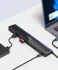 Heavy Duty 12 In 1 USB C Laptop Docking Station Delivers Killer Performance With Slick Triple Display Output connected to a laptop.