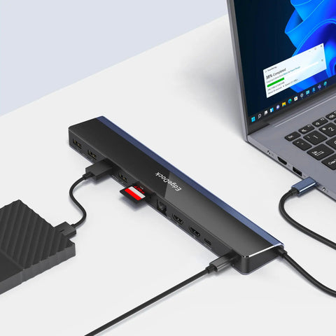 Heavy Duty 12 In 1 USB C Laptop Docking Station Delivers Killer Performance With Slick Triple Display Output connected to a laptop.