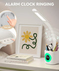 LED Desk Lamp With Clamp And Flexible Gooseneck, 9W White Task Light on nightstand with books and art print, touch control in use.