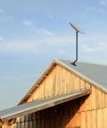 Built Tough Heavy Duty 1.5 Inch Antenna Mounting Pole 35 Inch Long J Mount for Starlink on rooftop against sky