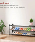 Expandable 3-Tier Shoe Rack For Closet And Entryway, Adjustable From 18 To 44 Inches, Fits 15-18 Pairs, Heavy-Duty Metal Black Shoe Organizer holding colorful sneakers in room.