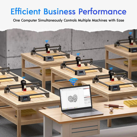 Workshop with multiple Powerful 5W Laser Engraver With 3.5 Inch Touch Screen on wooden tables, laptop showing engraving software.
