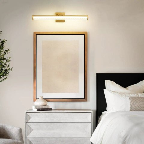 Brushed Gold 24 Inch Vanity Light With 3000K LED above bedside, modern water ripple shade, rust-resistant aluminum brass finish