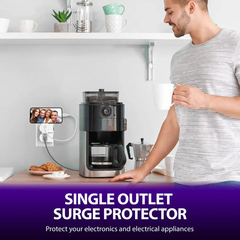 Man in a kitchen using a white grounded outlet with on off switch two pack 3 prong surge protector 245J single port power adapter.