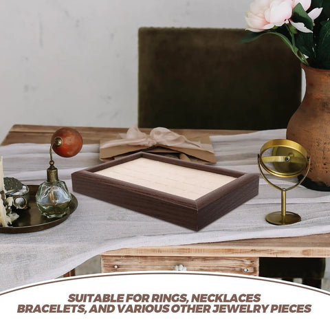 Solid Wood Earring Organizer And Ring Keeper Tray With Thirty Open Slots For Stashing Bracelets And Chains In A Rich Walnut Finish on a table.