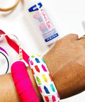 Close-up of hand showing Fast Drying Fabric Glue For Fabrics Canvas Lace Wood And More That Dries Crystal Clear In Minutes 8oz bottle