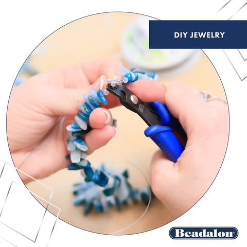 Person using pliers to make DIY jewelry with blue beads, highlighted as part of Beadalon’s craft toolkit.