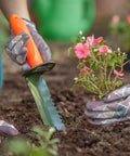 Prospector's Serrated Edge Digger Compact Shovel Trowel For Gardening And Metal Or Gold Prospecting And Detecting Includes Belt Loop Sheath With Oversized Comfort Grip And Carbon Steel Build in garden soil with gloved hands
