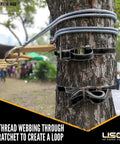 Endless Ratchet Straps 2 Inch Wide by 20 Foot Long Hookless 4 Pack black securing a tree trunk, heavy duty use.
