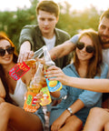 Friends using 18 Pack Funny Can Cooler Sleeves Set With Collapsible Beer And Bottle Sleeves In Bold Colors at a summer party