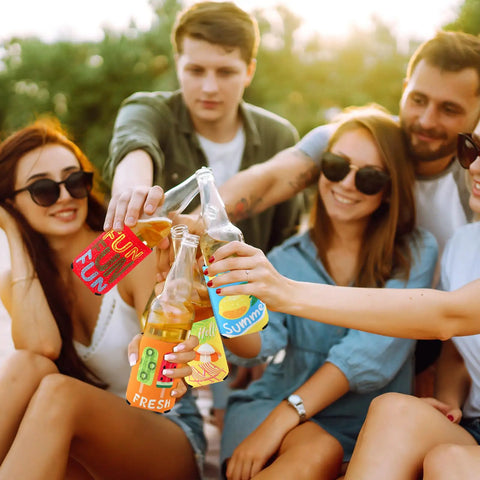 Friends using 18 Pack Funny Can Cooler Sleeves Set With Collapsible Beer And Bottle Sleeves In Bold Colors at a summer party