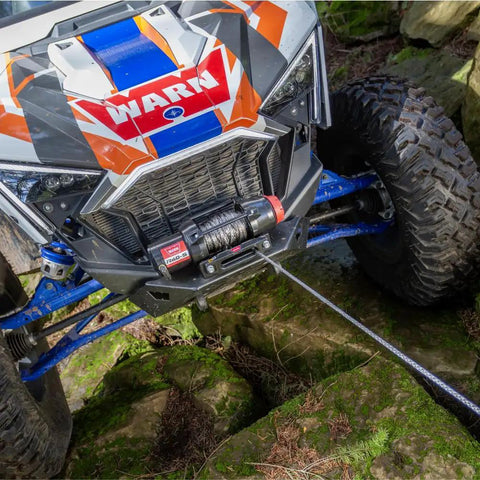 ATV using Hub Wireless Receiver for Powersports Winches with Bluetooth Smartphone Control in rocky terrain