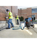 Two Hose Vacuum Y Connector For Dust Extractor System With Secure Fit Port and Tethered Cap in use on construction site