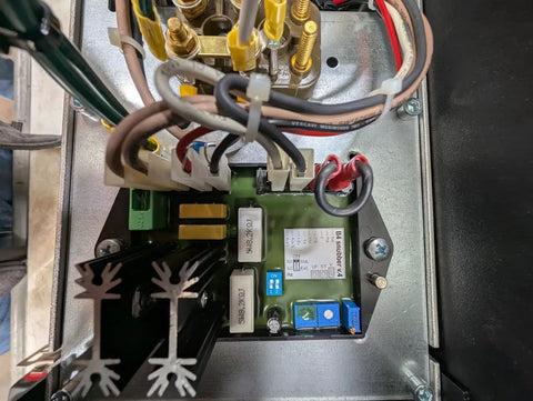 Real Deal 10Kw Pto Generator With Auto Voltage Regulator inner electrical components view, showcasing connections and circuit board details.