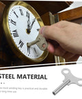 Person using Rugged Pro Grade Steel Clock Winding Key For Wall And Alarm Clocks, Handy Repair Tool Built To Last on wall clock