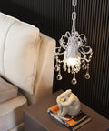 Crystal Chandelier Pendant Light White 1 Light for hallways, compact white body above modern side table and chair.