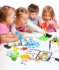 Children playing with 6 In 1 STEM Robotics Kit For Kids 8 To 13 With Reptile Robot Balance Car Bubble Machine Fiber Lamp And Buzzer Wire Game