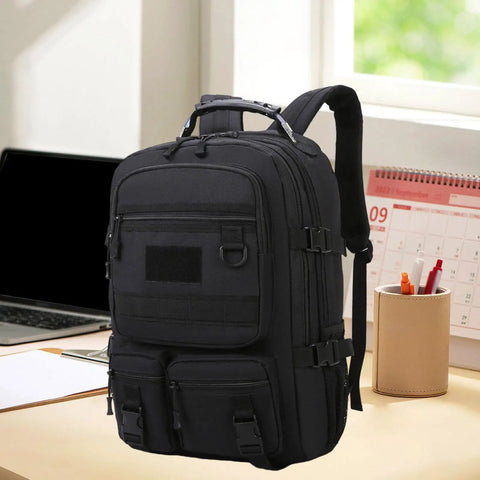 Rugged Hiking Backpack For Outdoor Adventures And Weekend Trips, black daypack with multiple pockets on a desk, all-weather durable