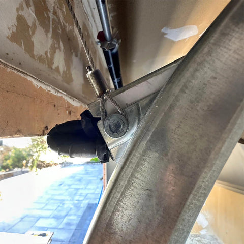 Close-up view of a heavy duty garage door torsion spring cable 2 pack, 8.6 feet long, one eighth inch galvanized steel wire rope, 7x7 strand.