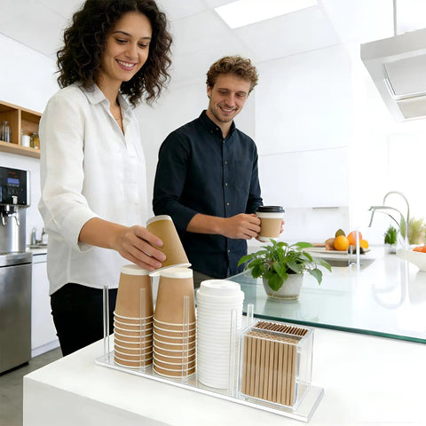 Two people using a clear acrylic coffee cup and lid holder with straw organizer five compartment disposable cup dispenser on counter.