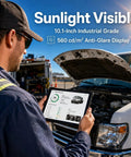 Man inspecting vehicle with Kickass Rugged Windows 11 Pro Tablet With 10 Inch Sunlight Display And Quick N100 Chip Packed With 8 GB Ram Plus A 2D Scanner Built Like A Tank For Outdoor Jobs And Trade Site Hustle.