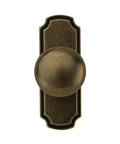 10 Pack 1 1/4 Inch Cabinet Knobs With Matching Backplates Antique Brass Vintage Drawer Pulls from a top view highlighting round shape.
