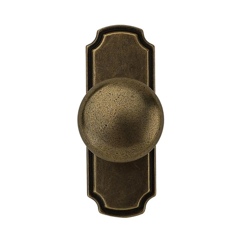 10 Pack 1 1/4 Inch Cabinet Knobs With Matching Backplates Antique Brass Vintage Drawer Pulls from a top view highlighting round shape.
