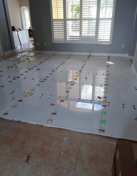 Pro Grade Tile Leveling System with 600 Spacers, 4 mm Clips installed on a floor for even tile grout lines in living area.
