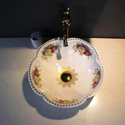 Floral-patterned ceramic vessel sink on countertop with dark faucet