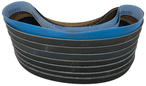 1x30 Sanding Belts 24 Pack Pro Grind Game Changer Set With Premium Silicon Carbide And Aluminum Oxide Abrasives Featuring Grits 80 To 2000 stacked for polishing glass and metal.