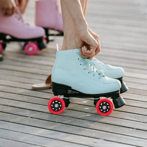 Red 92A Quad Roller Skate Wheels Replacement For Speed Skates Indoor Outdoor Use on a light blue skate on wood deck